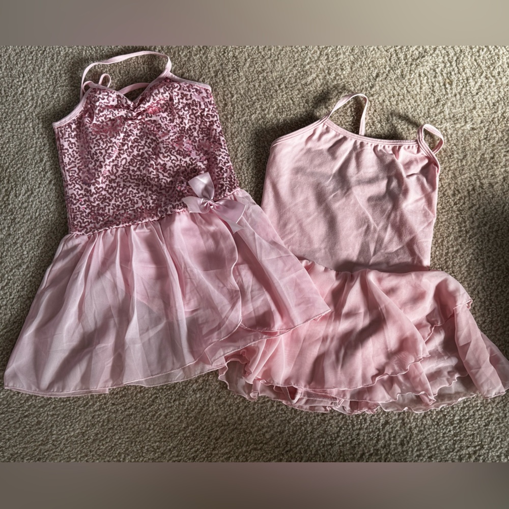2 ballet leotards  with attached skirt girls size XL 
Pink
